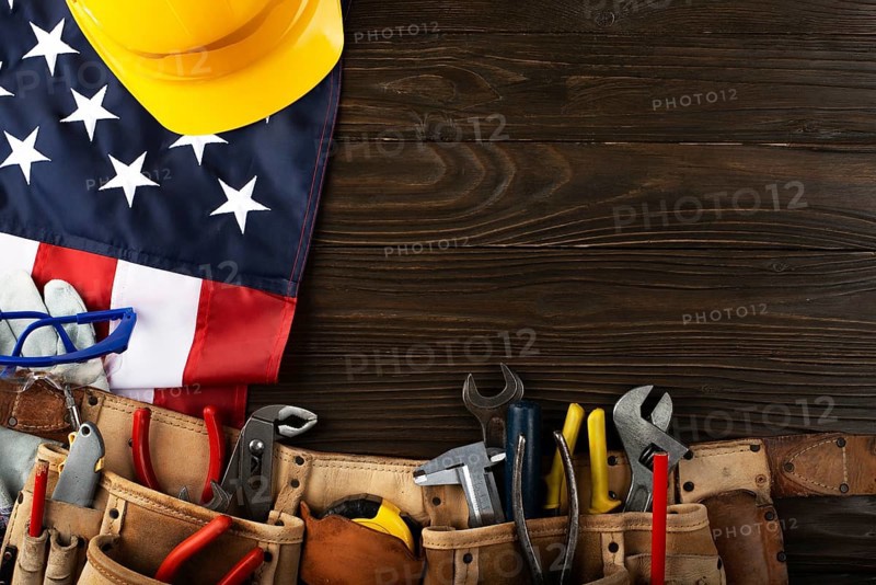 Tools hardhat toolbelt and us flag on wooden background labor day banner mockup