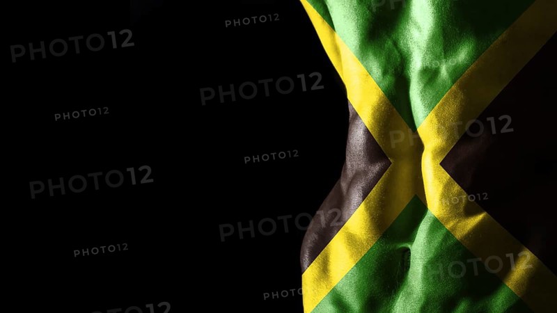 Jamaica flag on abs muscles national sport workout, bodybuilding concept, black background