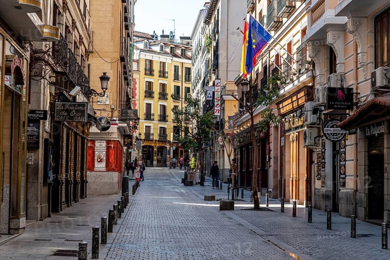 Madrid, Spain, April, 18 2021: Victoria Street Near Puerta del Sol Square. Empty view during coronavirus pandemic. The Street is Famous for the Taverns, bars, inns and pubs, Europe