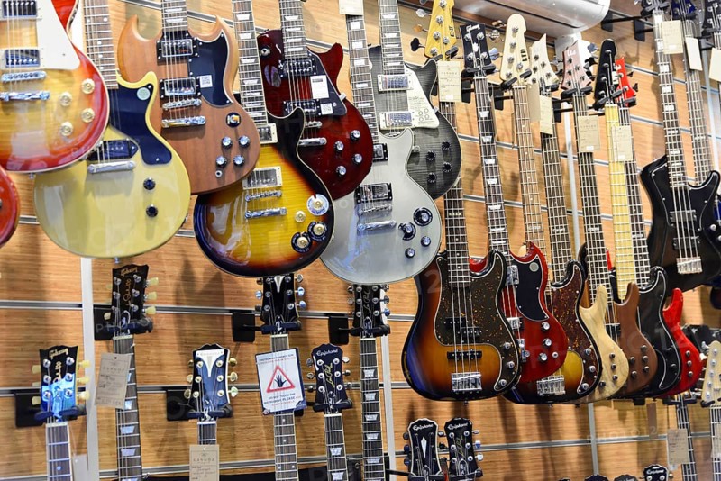 A music shop with a variety of hanging electric guitars in different designs, Istanbul, Istanbul Province, Turkey, Asia