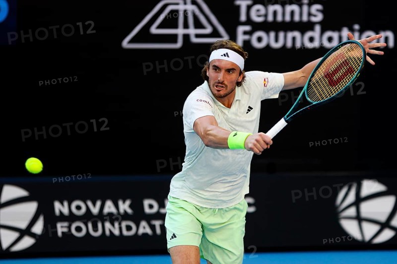 MELBOURNE, AUSTRALIA, JANUARY 11: Stefanos Tsitsipas of Greece plays against Novak Djokovic of Serbia during a charity match ahead of the 2024 Australian Open at Melbourne Park on January 11, 2024 in Melbourne, Australia, Oceania