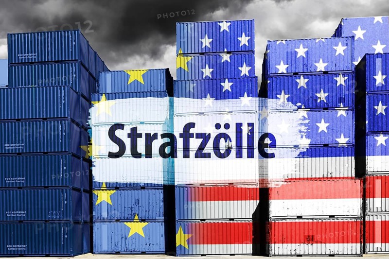 Stacked containers with European and US flags and the words punitive tariffs, symbolic photo trade between the USA and Europe, photomontage