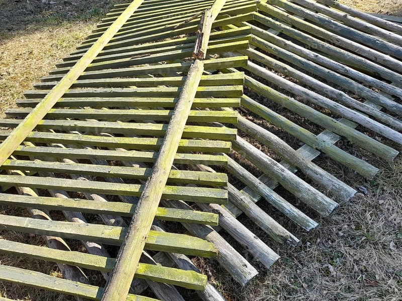 Old and broken wooden fence panels