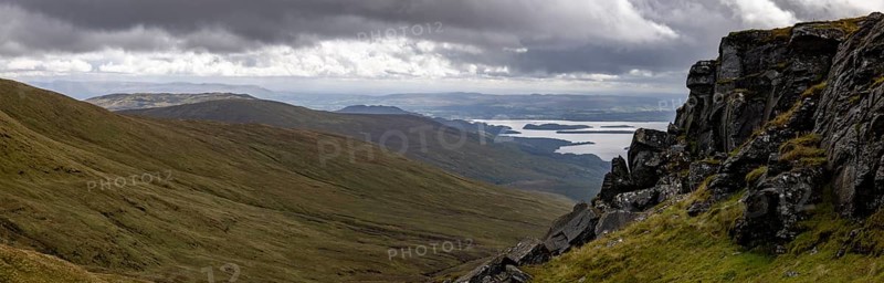Rocks at the summit and views of Loch Lomond and the Loch Lomond and the Trossachs National Park area, Ben Lomond, Rowardennan, Scotland, United Kingdom, Europe