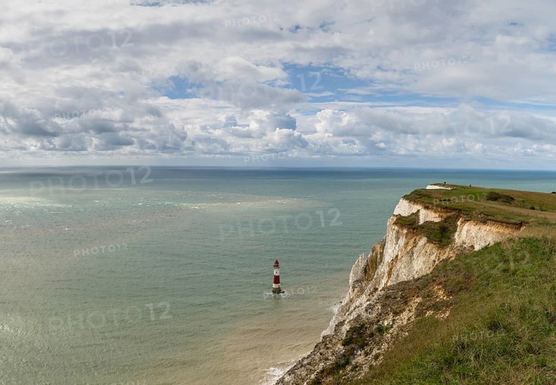 View of the Beachy Head Lighthouse in the English Channel and the white cliffs of the Jurassic Coast