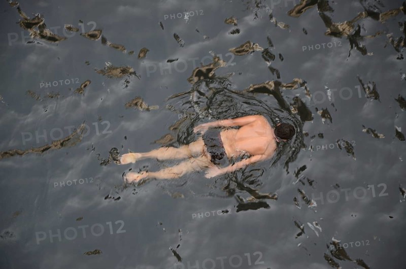 Man swimming in stepwell, jodhpur, rajasthan, India, Asia
