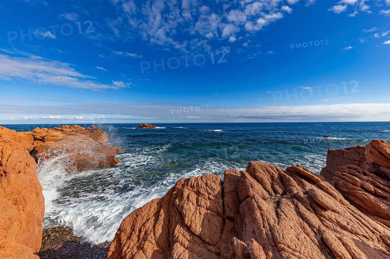 Coastal landscape with red rocks and surf in blue sky and sunshine, Spiaggia di Cala E'Luas, Ogliastra, Sardinia, Italy, Europe