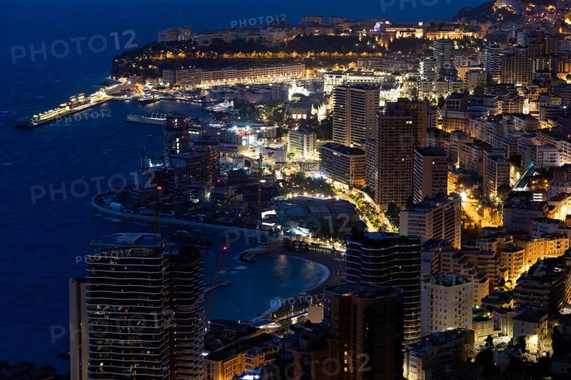 Monte Carlo panorama illuminated by night. Urban landscape with luxury architecture