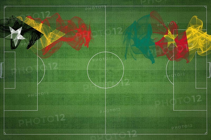 East Timor vs Cameroon Soccer Match, national colors, national flags, soccer field, football game, Competition concept, Copy space