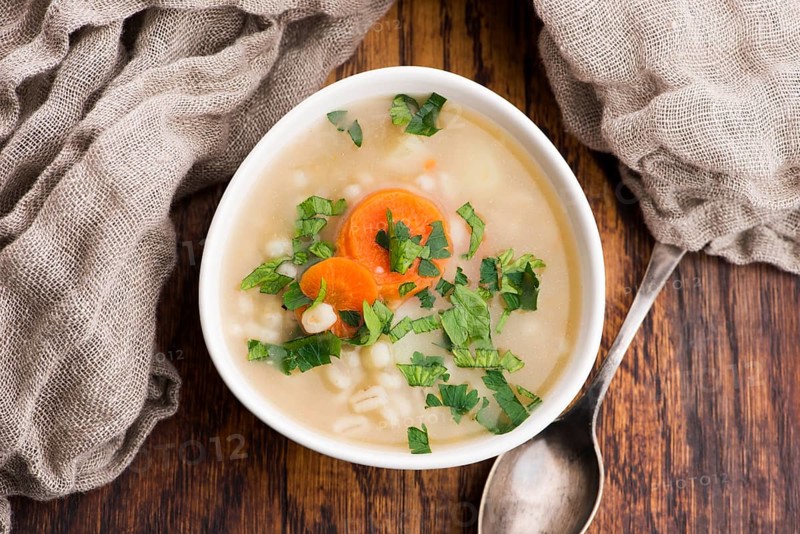 Barley soup, pearl barley in white bowl