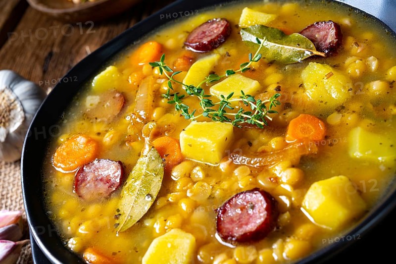 Rustic pea soup with bacon and sausage