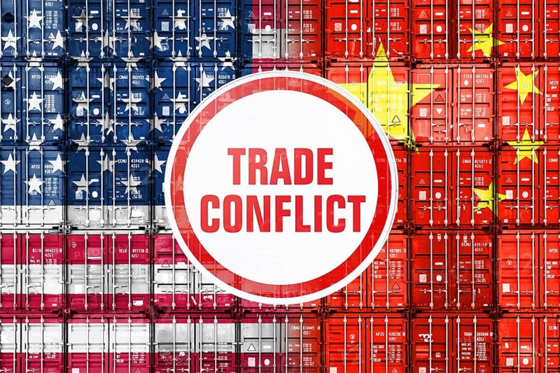Customs sign with the inscription Trade Conflict in front of stacked containers in us and Chinese national colours, symbolic photo trade war between the USA and China, photomontage