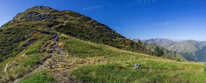 Couple ascending the path, Montcorbison, Aran Valley, Lérida province, Spain, Europe