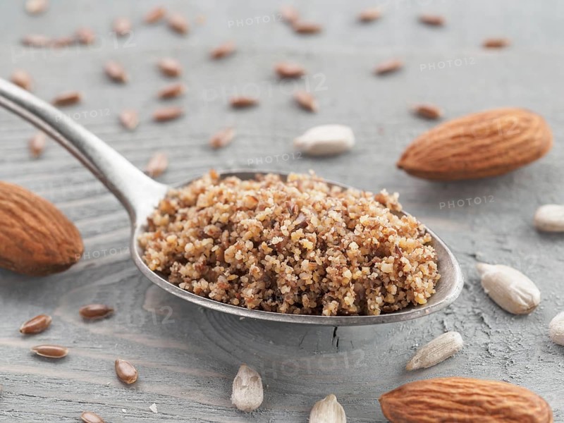 Homemade LSA mix in spoon - Linseed or flax seeds, Sunflower seeds and Almonds. Traditional Australian blend of ground, source of dietary fiber, protein, omega fatty acids. Copy space for text