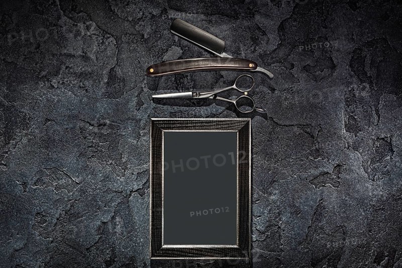 Black Stright Razor Scissors And Empty Frame In Barbershop Concept On Stone Slate Background