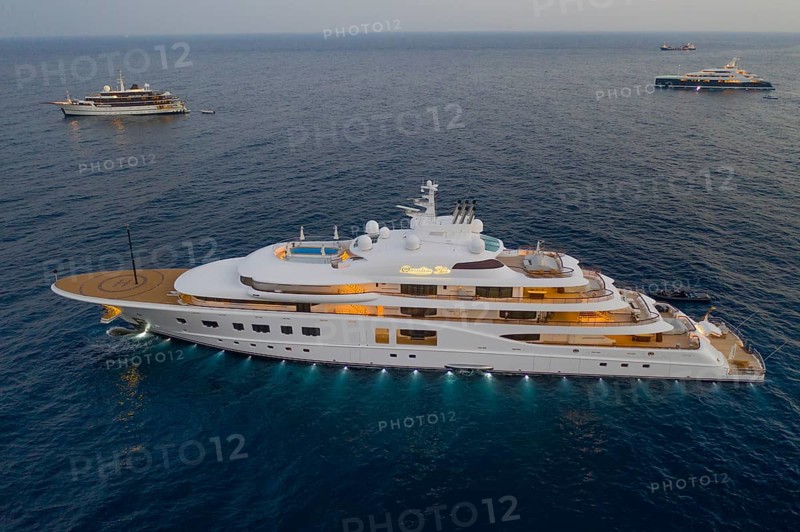 Aerial view of 104 metre motor yacht QUANTUM BLUE, delivered in 2014 by the German shipyard Lürssen Yachts, anchored off the Principality of Monaco, Mediterranean Sea, shortly after sunset