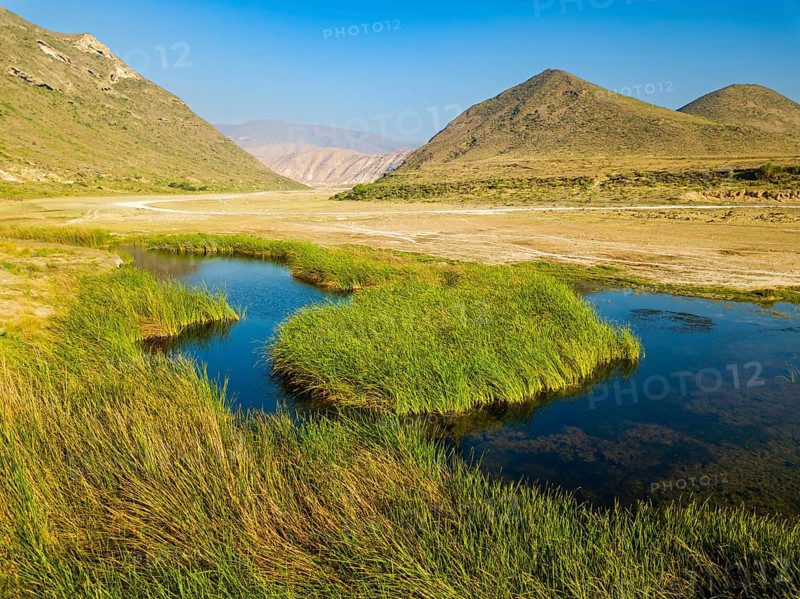 Landscape in Oman, mountains, Wadi Ashawq, road, reeds, waters Salalah, Al Mughsyal / Wadi Ashawq, Dhofar, Oman, Asia