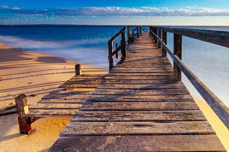 Piers near Millionaire's Walk at Point King Beach on a cool winter's morning at sunrise on the Mornington Peninsula in Sorrento, Victoria, Australia, Oceania