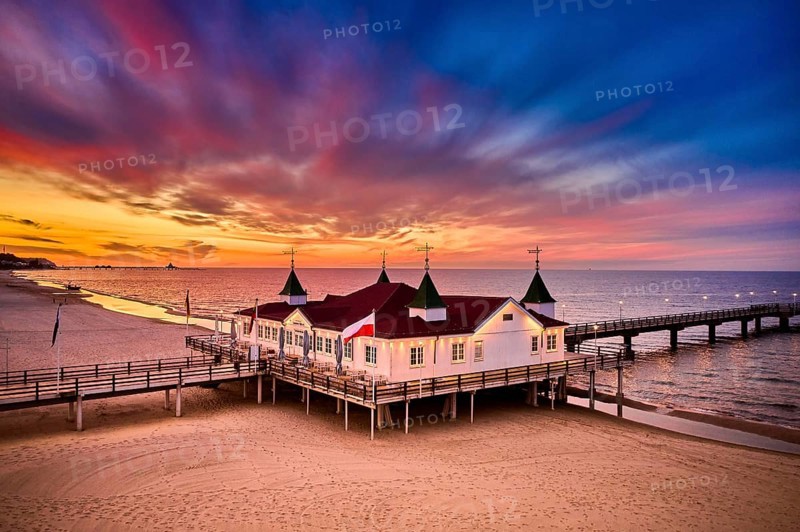 Morning time at baltic sea beach and sight Ahlbeck pier in sunrise