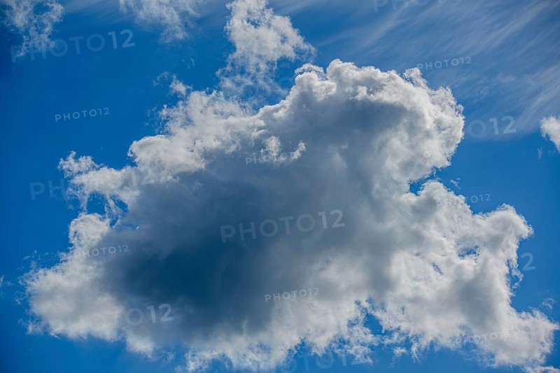 Large, dramatic cloud against a blue sky, creating both light and shadow, Mitterteich, Upper Palatinate, Bavaria, Germany, Europe