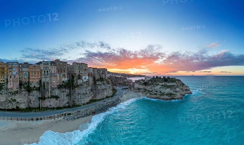 Tropea, Italy, 16 December, 2023: panorama view of Rotonda Beach and the colourful old town of Tropea in Calabria at sunset, Europe