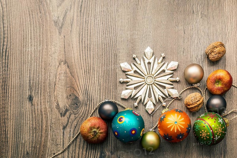 Christmas decoration glass balls on a wooden background