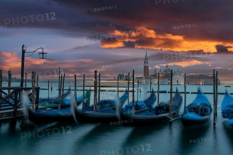 Moored Gondolas during High Tide at the St Marks Square in the early morning, Venice