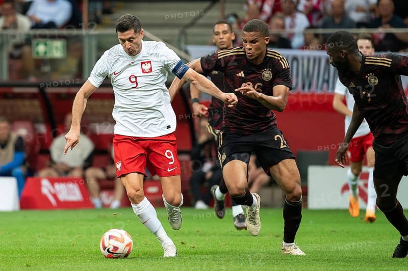 WARSAW, POLAND - JUNE 16, 2023: Friendly football match Poland vs Germany 1:0. In action Robert Lewandowski (L) and Malick Thiaw (R).