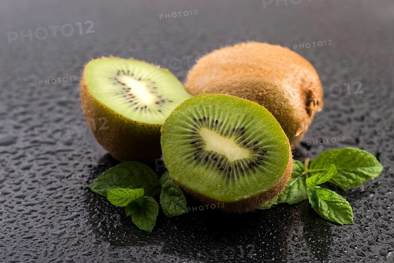 Juicy kiwi fruit and freas mint leaves