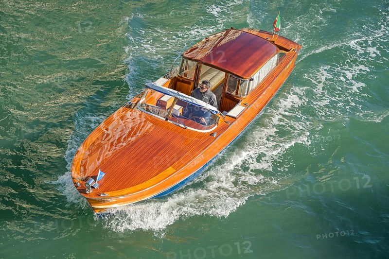 Wooden boat on the Grand Canal, possibly a Riva boat, Venice, Veneto, Italy, Europe