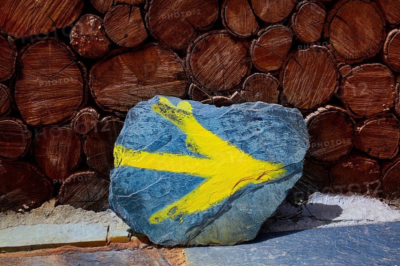 O Cebreiro by the way of Saint James in Galicia yellow arrow sign Spain