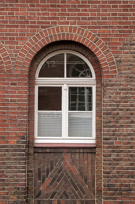 Large mullioned window on a 100-year-old building