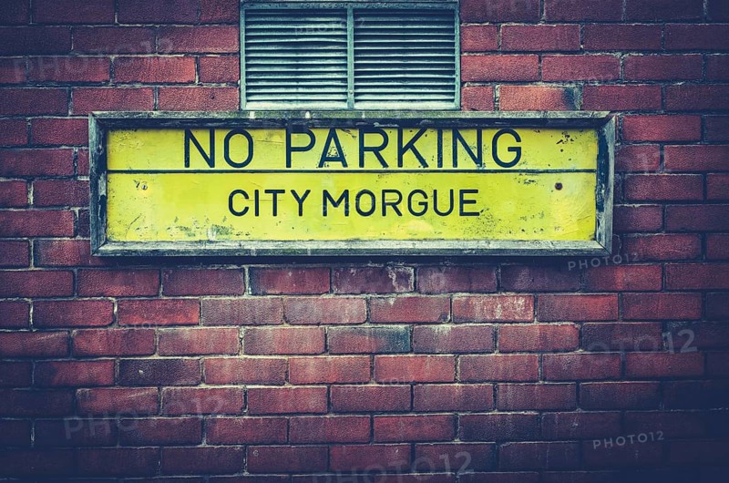 A No Parking Sign Outside A City Morgue In A US City