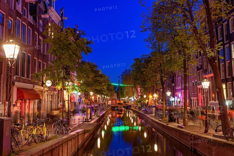 Night view of De Wallen, the famous red-light district with window prostitution in Amsterdam, Netherlands