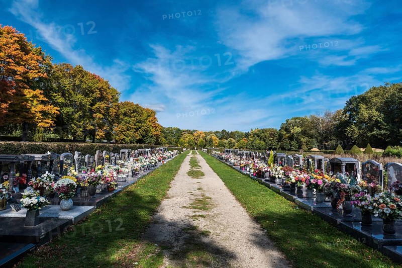 Anderlecht, Brussels, Belgium, 10 11 2018: Decorated grave yards on a cemetery against blue sky, Europe