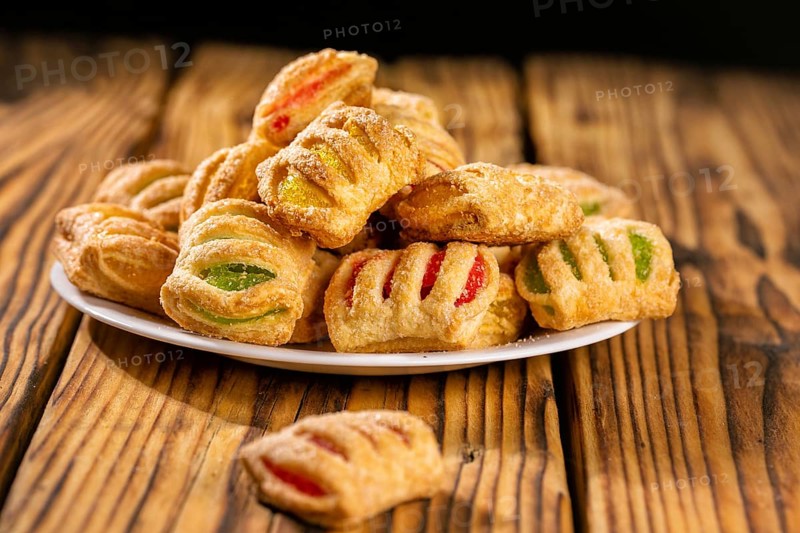 Cookies from puff pastry with coloured jam