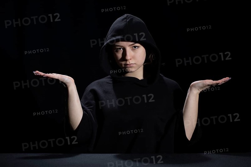 A young woman is waiting for the development of the situation in difficult conditions on the labor market
