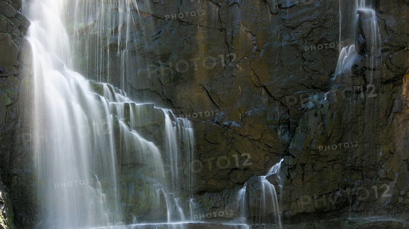 Detail of a waterfall in long exposure and rocky background, Australia, Oceania