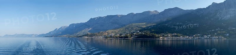 Mountain range by the sea in the morning light, panoramic shot, Makarska Riviera, near Makarska, Dalmatia, Croatia, Europe