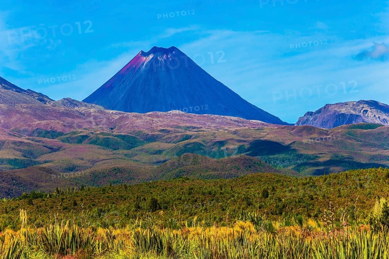 Ngauruhoe - the youngest active volcano, perfectly regular cone-shaped. Magnificent volcanic massif of Tongariro Park. North Island, New Zealand. The concept of active and phototourism