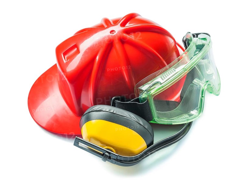 Construction tools red helmet yellow headphones and green goggles isolated on white background