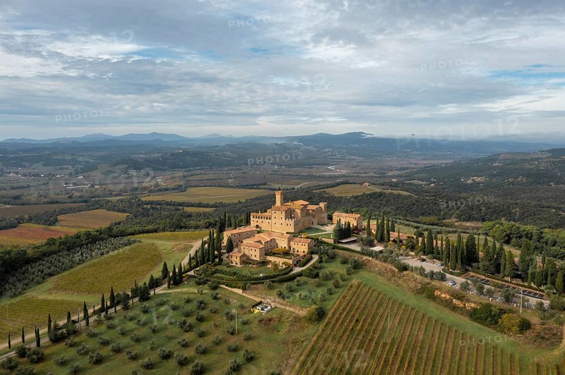 Montalcino, Italy, 16 November, 2023: aerial view of the Poggio alle Mura Castle and Villa Banfi wine resort in Tuscany, Europe