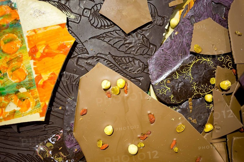 Handmade and painted chocolate. Brown milky and dark chocolade. Extremely tasty and delicious desserts. Sweets full with sugar. Unhealthy food diet