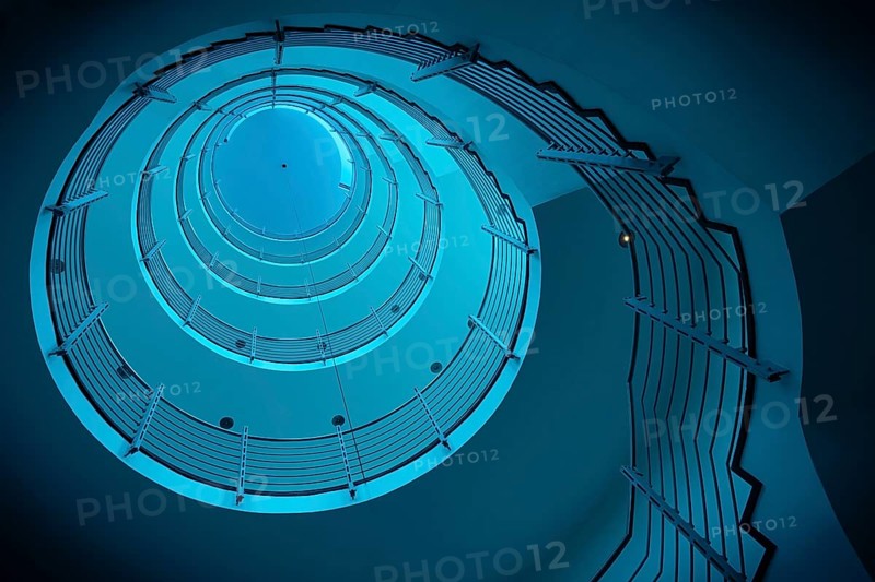 Futuristic spiral staircase in blue light with metallic railings, Free and Hanseatic City of Hamburg, Germany, Europe