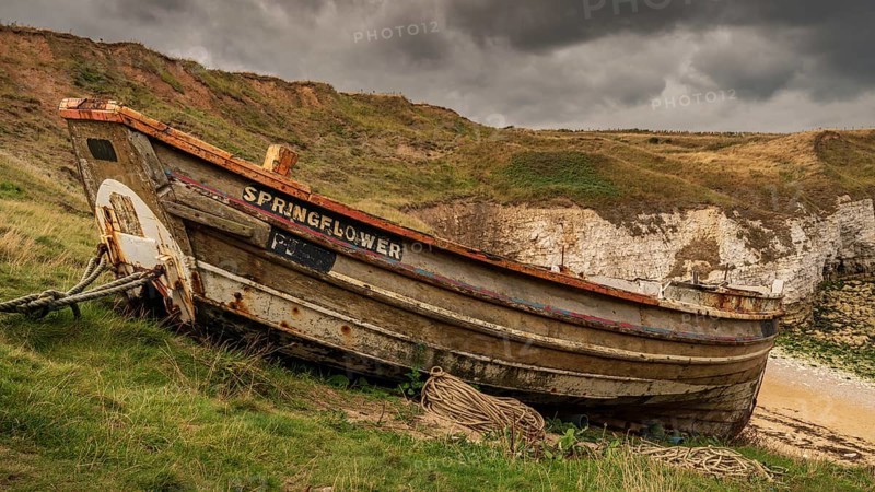 Flamborough, East Riding of Yorkshire, England, UK, September 14, 2018: An old fishing boat on the cliffs of Flamborough North Landing