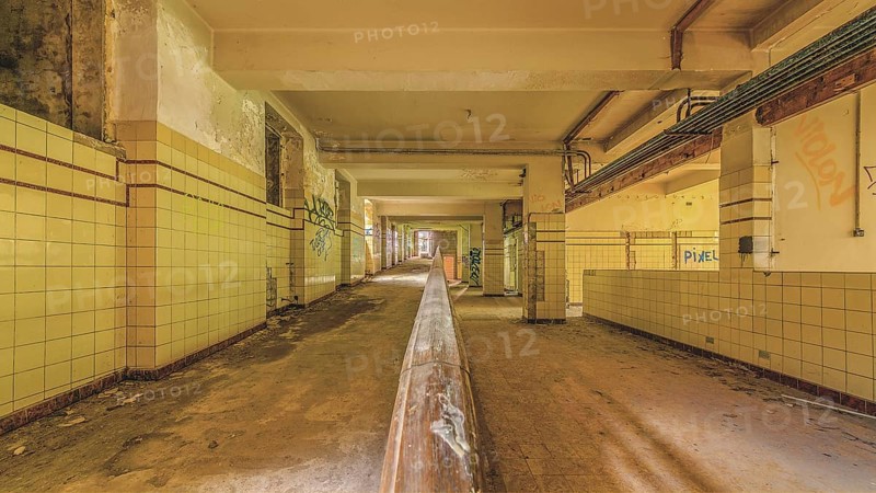 Long abandoned corridor with tiled walls and graffiti, industrial decay, Preventorium Dolhain, Lost Place, Limbourg, Province of Liège, Belgium, Europe