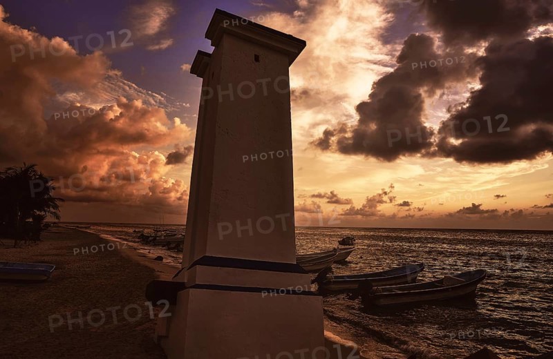 Puerto Morelos sunset lighthouse in Mayan Riviera Maya of Mexico