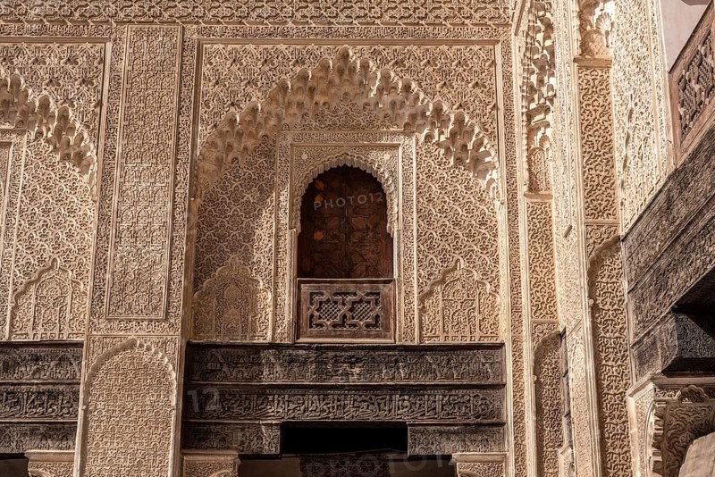 Fes, Morocco, April 05, 2023, Traditional oriental facade at the courtyard of madrasa Bou Inaniya in the medina of Fes, Morocco, Africa