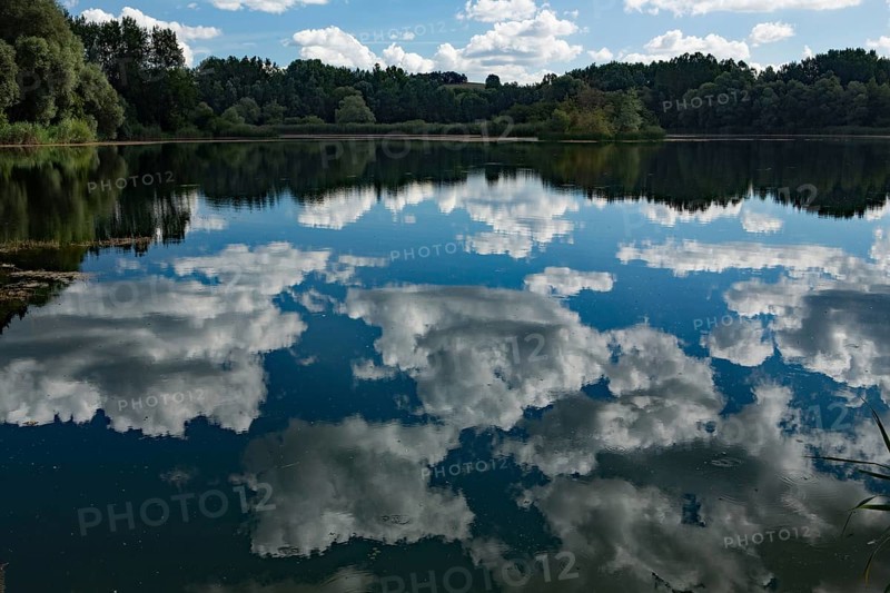 Old water with white clouds
