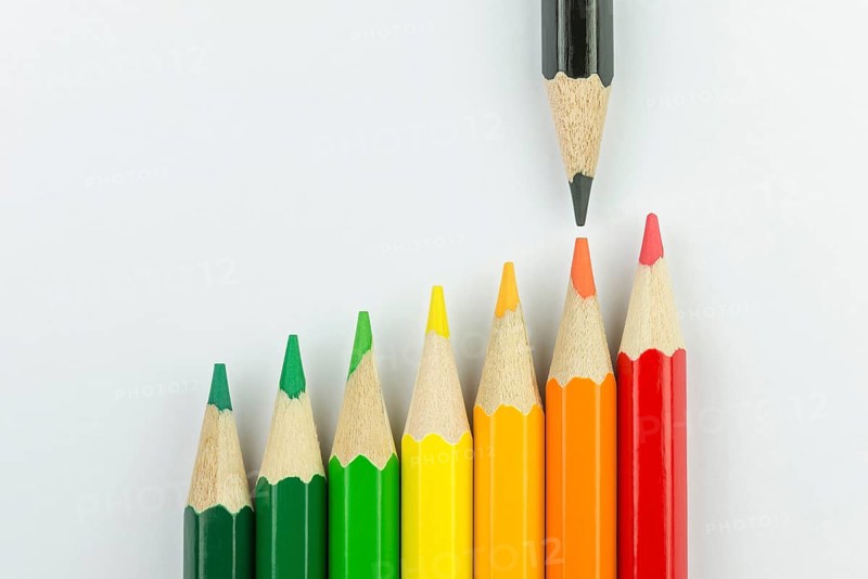 Conceptual crayons represented as successor energy label colors with black pencil that indicates the energy label